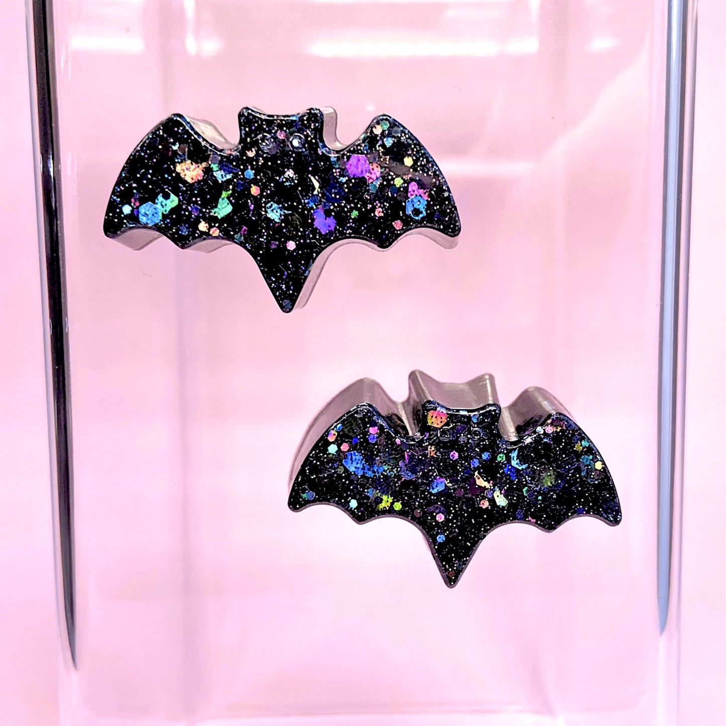 Jumping spider bat ledges in glitter black variation placed inside the enclosure