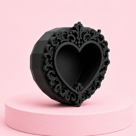 Black magnetic jumping spider hide with ornate heart frame and faceted design, front angled view