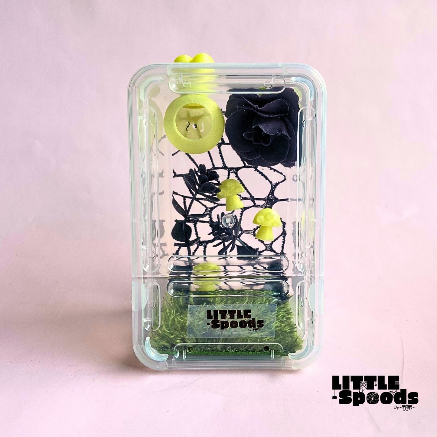 Yellow handmade whimsical gothic juvenile jumping spider enclosure featuring magnetic hide, mushrooms, black flower, and spider-safe décor.